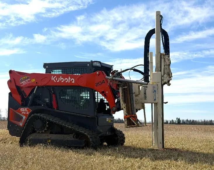 The track-mounted push-probe rig set up on a stubble field.