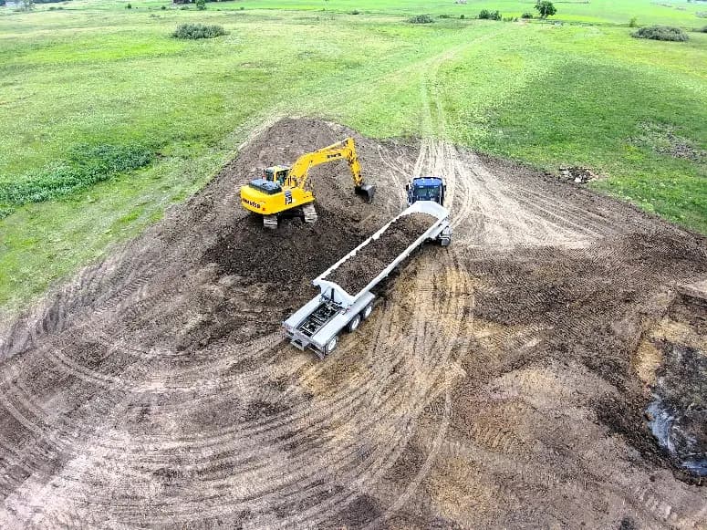 An excavator loads out material at MRPSU 36-21 North.