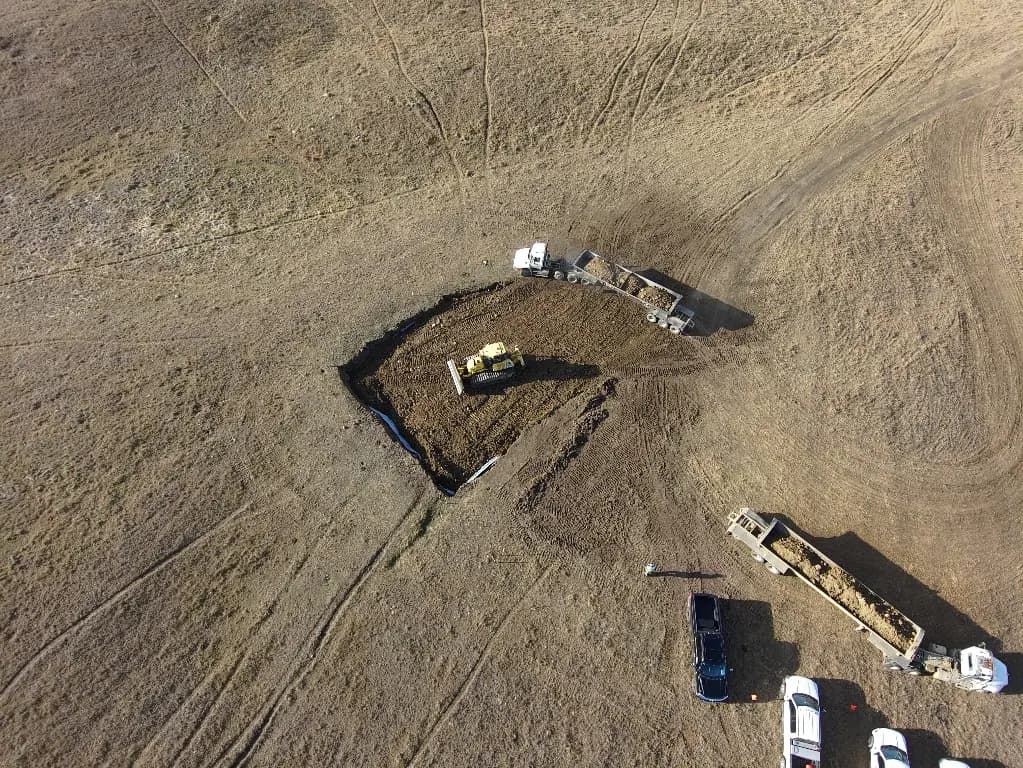 Aerial view of the excavation and haul trucks at State 16-31.