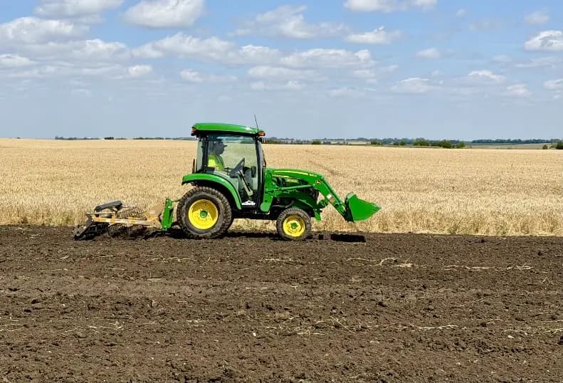 A tractor works the restored ground at Susan Anderson 1 ahead of seeding.