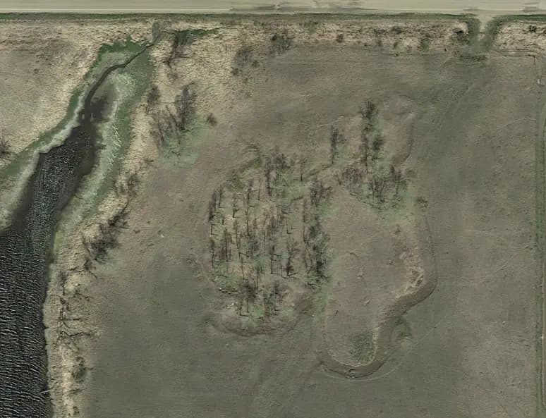 Aerial view of the worked-out sand and gravel pit west of Tioga before reclamation.